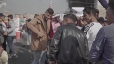 Unidentified people demonstrating against the Iraqi government at the 2019 Iraqi protests, also named Tishreen Revolution or Iraqi Intifada in Baghdad, 2019