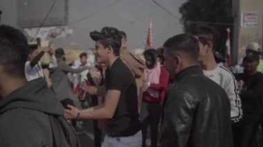 Unidentified people demonstrating against the Iraqi government at the 2019 Iraqi protests, also named Tishreen Revolution or Iraqi Intifada in Baghdad, 2019