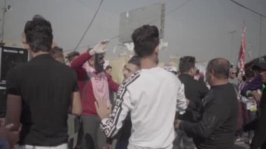 Unidentified people demonstrating against the Iraqi government at the 2019 Iraqi protests, also named Tishreen Revolution or Iraqi Intifada in Baghdad, 2019
