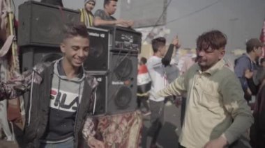 Unidentified people demonstrating against the Iraqi government at the 2019 Iraqi protests, also named Tishreen Revolution or Iraqi Intifada in Baghdad, 2019