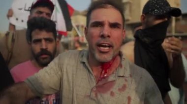 2019 'daki Irak protestolarında Irak hükümetine karşı gösteri yapan kimliği belirsiz kişiler, ayrıca 2019' da Bağdat 'ta Tishreen Devrimi veya Irak İntifadası olarak adlandırıldı.