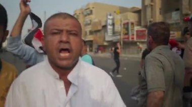 Unidentified people demonstrating against the Iraqi government at the 2019 Iraqi protests, also named Tishreen Revolution or Iraqi Intifada in Baghdad, 2019
