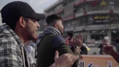 Unidentified people demonstrating against the Iraqi government at the 2019 Iraqi protests, also named Tishreen Revolution or Iraqi Intifada in Baghdad, 2019