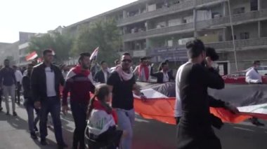 Unidentified people demonstrating against the Iraqi government at the 2019 Iraqi protests, also named Tishreen Revolution or Iraqi Intifada in Baghdad, 2019
