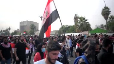 Unidentified people demonstrating against the Iraqi government at the 2019 Iraqi protests, also named Tishreen Revolution or Iraqi Intifada in Baghdad, 2019
