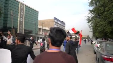 Unidentified people demonstrating against the Iraqi government at the 2019 Iraqi protests, also named Tishreen Revolution or Iraqi Intifada in Baghdad, 2019