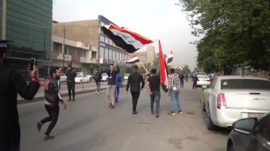 Unidentified people demonstrating against the Iraqi government at the 2019 Iraqi protests, also named Tishreen Revolution or Iraqi Intifada in Baghdad, 2019