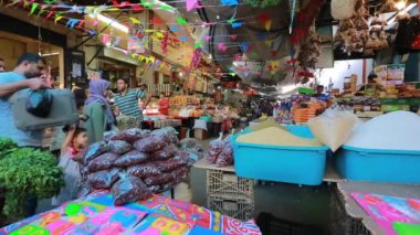Unidentified people at a market in Gaza City, West Bank, the largest city of the State of Palestine, circa August 2021