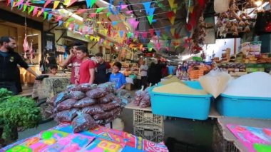 Unidentified people at a market in Gaza City, West Bank, the largest city of the State of Palestine, circa August 2021