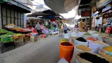 Unidentified people at a market in Gaza City, West Bank, the largest city of the State of Palestine, circa August 2021