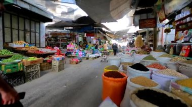 Unidentified people at a market in Gaza City, West Bank, the largest city of the State of Palestine, circa August 2021