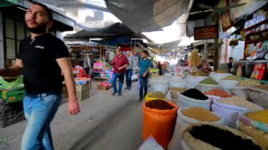 Unidentified people at a market in Gaza City, West Bank, the largest city of the State of Palestine, circa August 2021