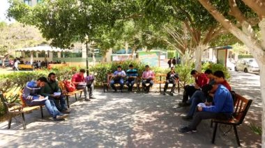 Unidentified people in a park in Gaza City, West Bank, the largest city of the State of Palestine, circa August 2021