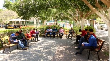 Unidentified people in a park in Gaza City, West Bank, the largest city of the State of Palestine, circa August 2021