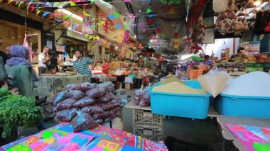 Unidentified people at a market in Gaza City, West Bank, the largest city of the State of Palestine, circa August 2021