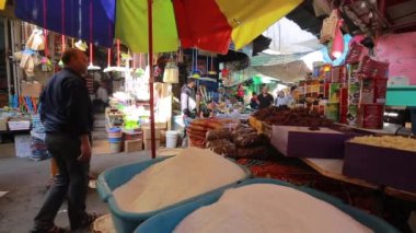 Unidentified people at a market in Gaza City, West Bank, the largest city of the State of Palestine, circa August 2021