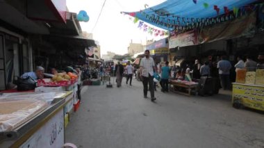 Unidentified people at a market in Gaza City, West Bank, the largest city of the State of Palestine, circa August 2021