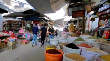 Unidentified people at a market in Gaza City, West Bank, the largest city of the State of Palestine, circa August 2021