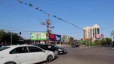 Unidentified people and street traffic in Gaza City, West Bank, the largest city of the State of Palestine, circa August 2021