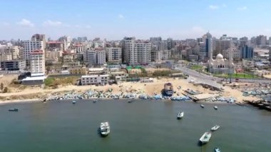 Drone footage of the Mediterranean Sea and Gaza City, West Bank, the largest city of the State of Palestine, circa August 2021.