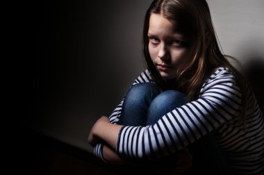 Portrait of a sad little girl clipart