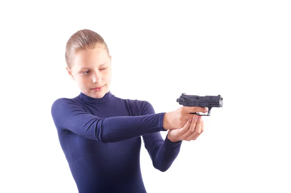 Cute teen girl with gun isolated on white — Stock Photo, Image