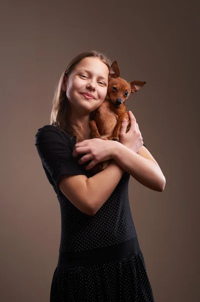 Pretty teenager girl with little doggy — Stock Photo, Image