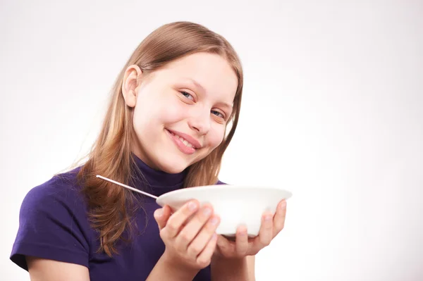 Portrait of a teen girl with spoon — Stock Photo, Image