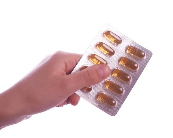 Hand holding  pills on white background — Stock Photo, Image