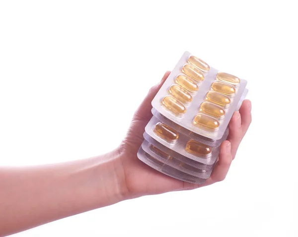 Hand holding  pills on white background — Stock Photo, Image