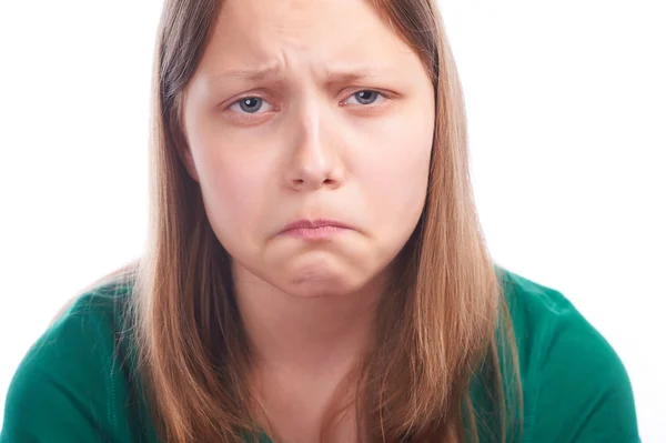 Teenager-Mädchen macht lustige Gesichter auf weißem Hintergrund — Stockfoto