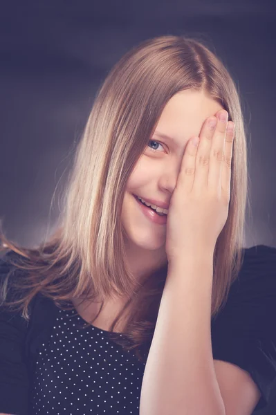 Happy teen girl with her hand on face — Stock Photo, Image
