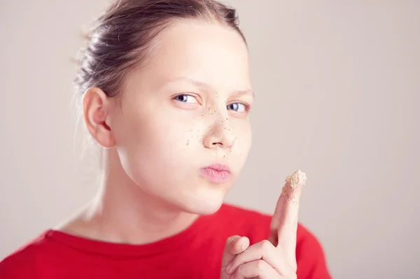 Happy teen girl with scrub mask on her face — Stock Photo, Image