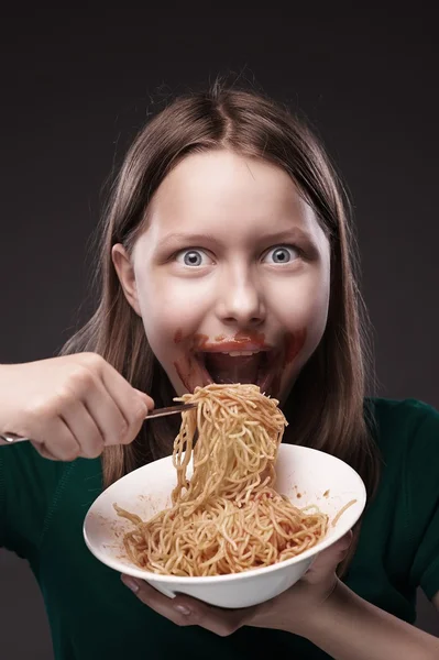 Teen girl greedily eating — Stock Photo, Image
