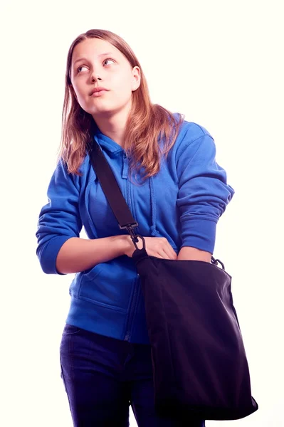 Adolescente à procura de algo em um saco — Fotografia de Stock
