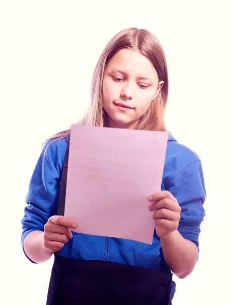 Teen girl standing with schoolbag and paper — Stock Photo, Image