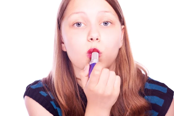 Teen girl colors lips — Stock Photo, Image