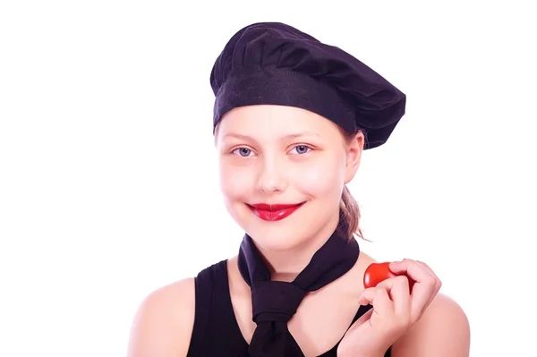 Adolescente chica comer tomate — Foto de Stock