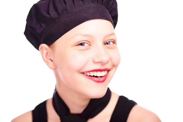 Teen flicka klädd i kock hat — Stockfoto