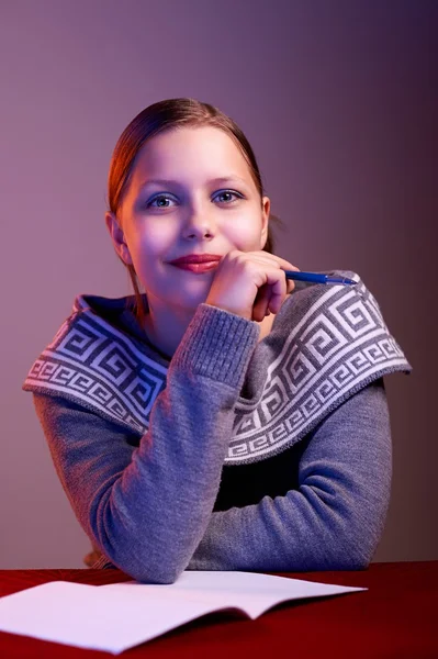 Teen girl doing her homework — Stock Photo, Image