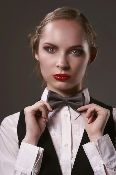 Woman dressed in suit and bow tie — Stock Photo, Image