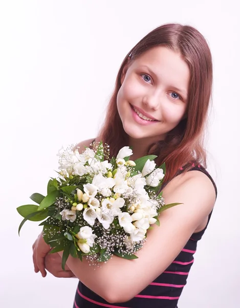 Teen girl with a bouquet of flowers — Stock Photo, Image