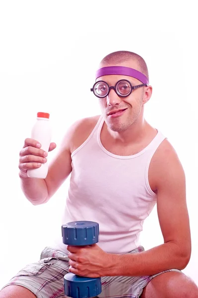 Nerd guy with dumbbell and bottle — Stock Photo, Image