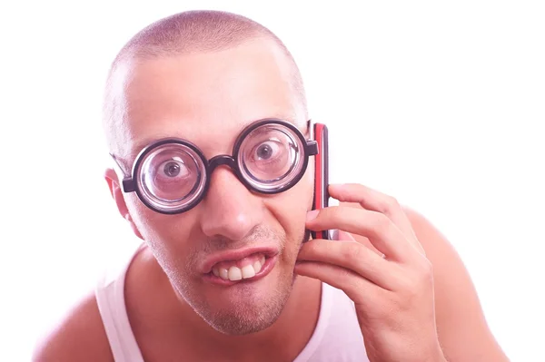 Nerd satisfecho en llamadas de anteojos por teléfono móvil — Foto de Stock