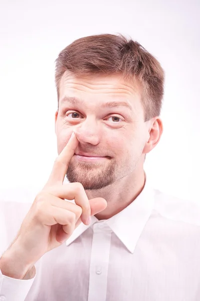 Dummer Mann, der sich die Nase zuhält — Stockfoto