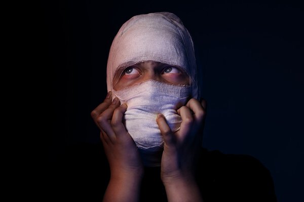 Infected sick girl with a bandage on her head