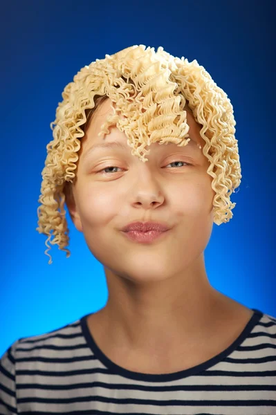 Funny teen girl with macaroni instead hair — Stock Photo, Image