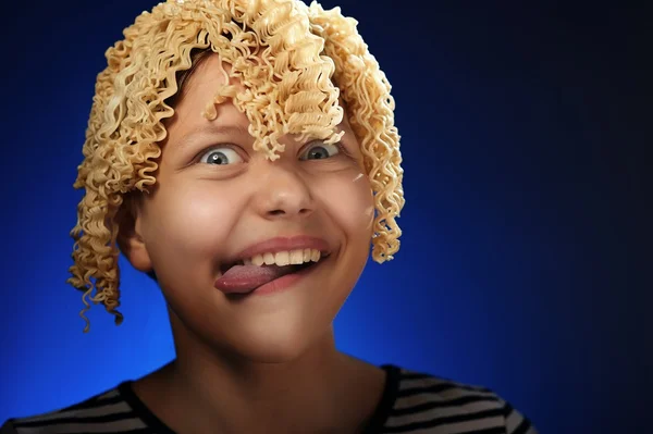 Funny teen girl with macaroni instead hair — Stock Photo, Image