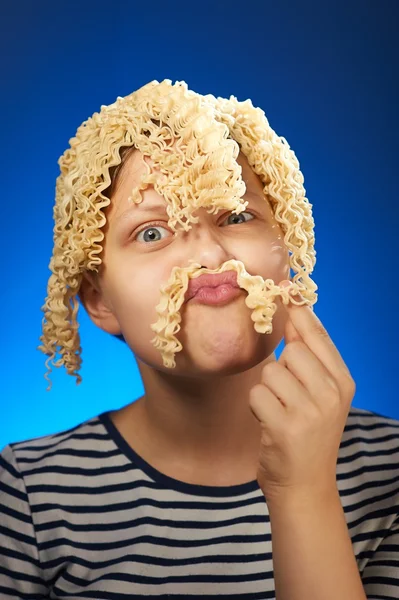 Funny teen girl with macaroni instead hair — Stock Photo, Image