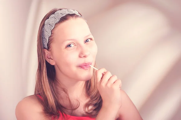 Funny teen girl eating lollypop — Stock Photo, Image